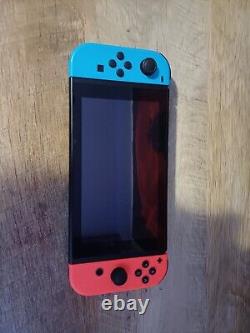 Nintendo switch- Black- Red and blue joycons- Slightly used- Good condition