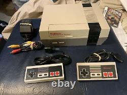 Original nes nintendo with all cords 2 controllers tested & working Good Condition