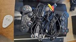 PS3 console 60GB with 2 controllers and 18 games. In very good condition