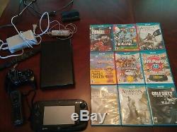 Wii U console black 32GB bundle with 9 games used in very good condition
