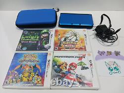 Console Nintendo 3DS XL Bleu NTSC avec lot de 4 jeux et étui en bon état