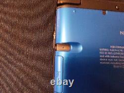 Console Nintendo 3DS XL bleue avec un jeu et un chargeur, TESTÉE en bon état