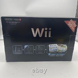 Console Nintendo Wii noire dans sa boîte, aucun jeu inclus, très bonne condition, testée