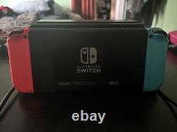 Console portable Nintendo Switch 32 Go - Rouge néon/Bleu néon en très bon état