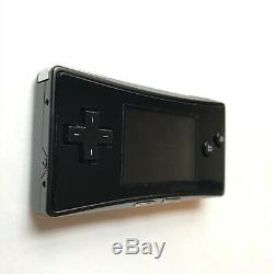 Game Boy Micro Oxy-001 Noir Avec Chargeur Faceplate Bon État Quelques Rayures