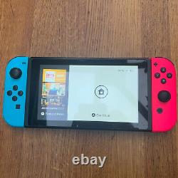 Nintendo Console Switch Avec Neon Bleu Et Rose Joy-cons Bon État
