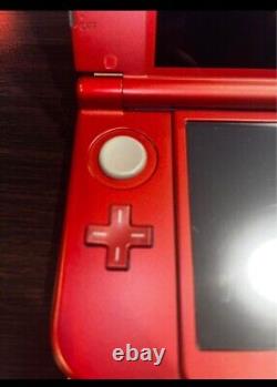 Nouvelle console Nintendo 3DS XL rouge métallique. Chargeur. 2 jeux. Bon état. États-Unis